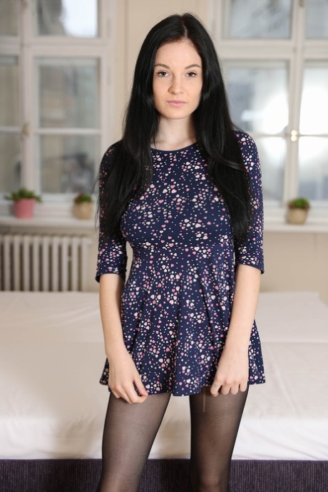Dark haired teen Angel Princess toys her bald pussy after getting naked