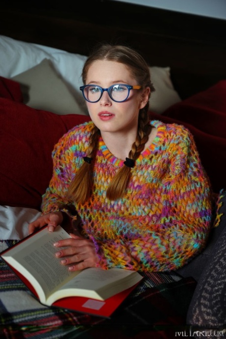 Young girl Laura Lit gets naked with her hair in braided pigtails