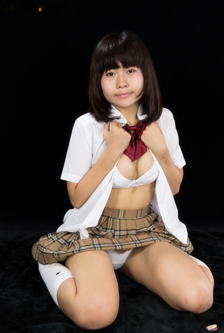 Young -looking Japanese girl sucks on a finger after giving a blowjob