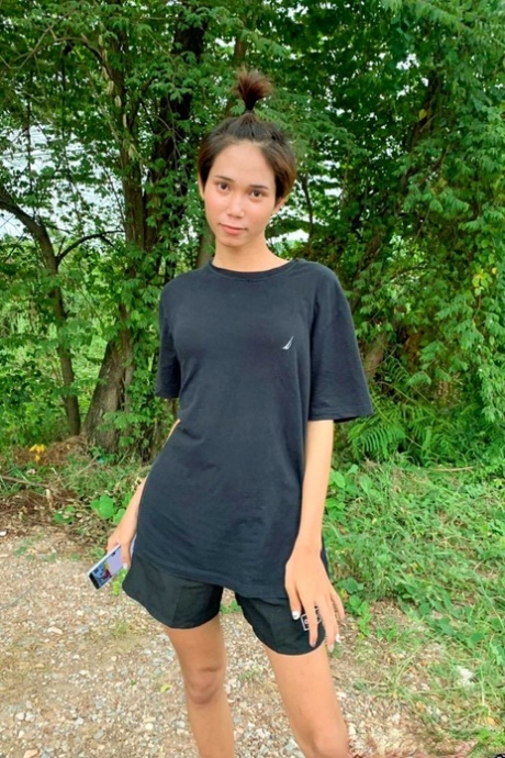 Gorgeous Asian shemale posing fully clothed in public in her own compilation