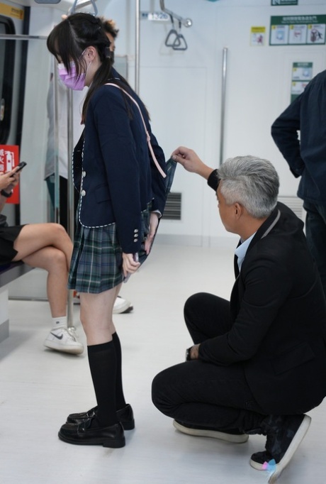 Asian schoolgirl Yuli has doggystyle sex with a senior on the train